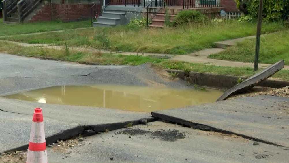 Sinkhole opens up after water main break in northeast Baltimore