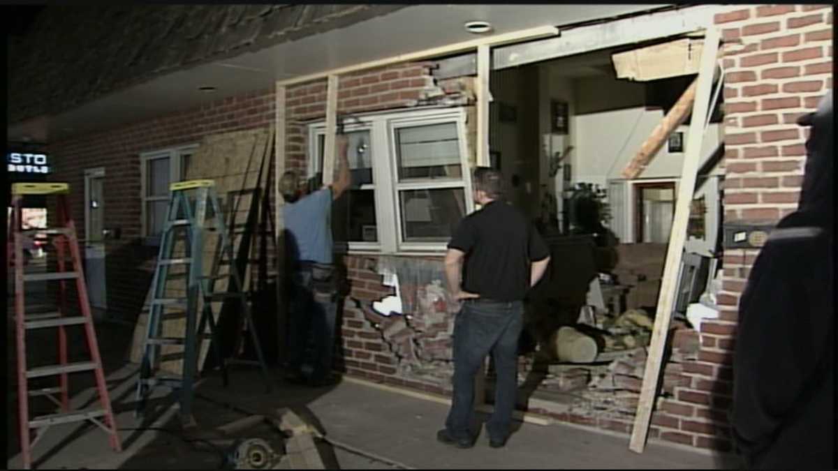 Woman injured after SUV crashes into apartment