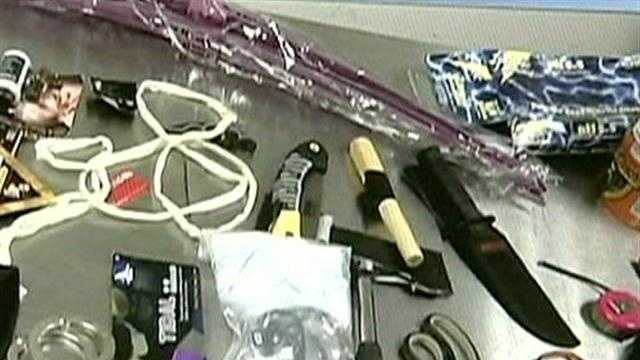 Man arrested after smoke grenade found in luggage