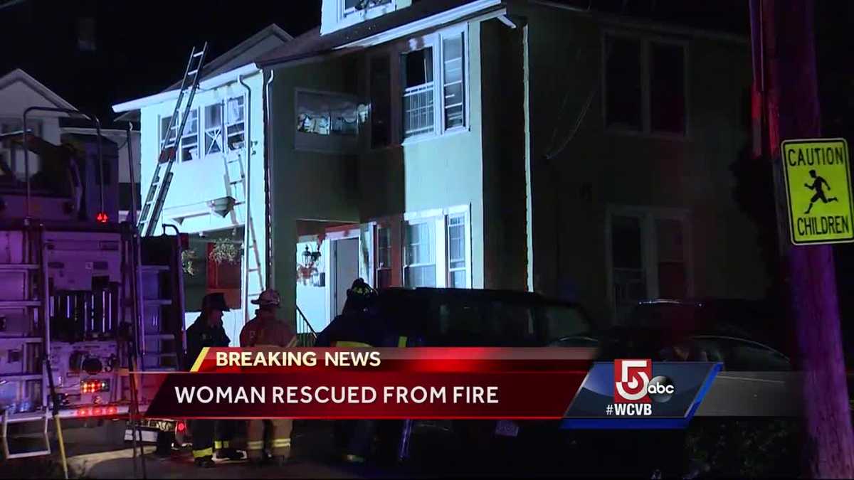 Woman rescued from burning home