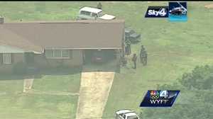 Standoff with a man accused of shooting his neighbor ends with the ...