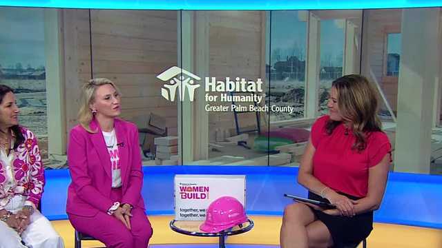 Getting the keys: Habitat family ready to move into their new home