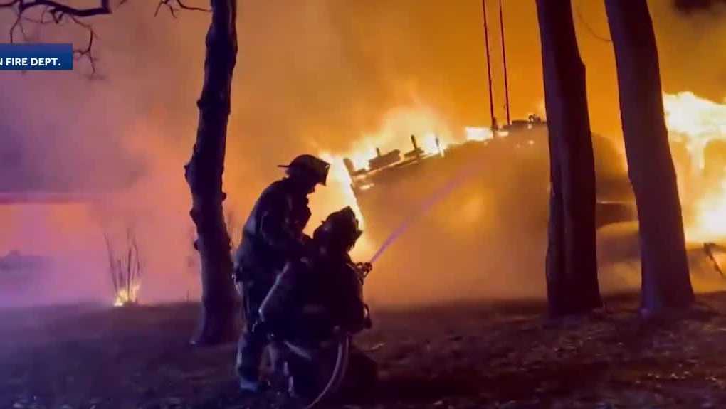 Multiple fire departments in Iowa fight a fire that engulfed a house