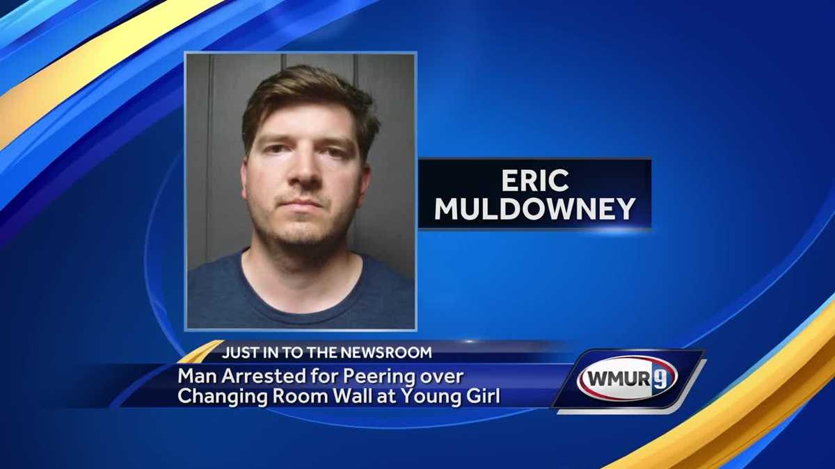 Mass. man accused of peering over changing room wall at young girl