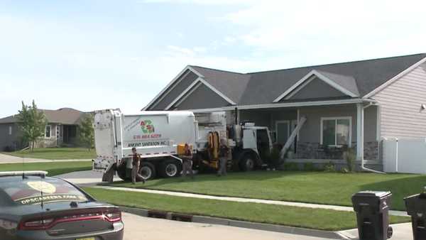 garbage truck crashes into waukee home