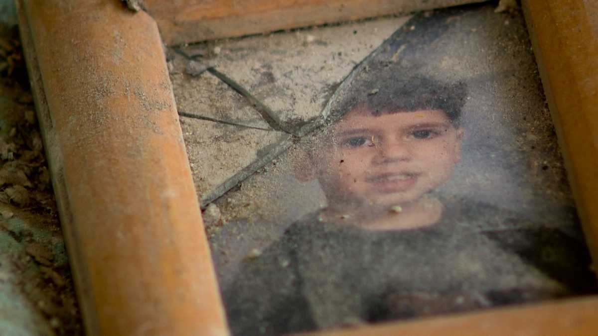 20 years ago, he found a photo of a boy in the rubble of 9/11