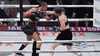 Katie Taylor, right, lands a right to Amanda Serrano during their undisputed super lightweight title bout, Friday, Nov. 15, 2024, in Arlington, Texas. (AP Photo/Julio Cortez)