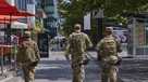 Armed members of the Ohio National Guard patrol The Wharf, Monday, Aug. 25, 2025, in Washington. (AP Photo/Jacquelyn Martin)
