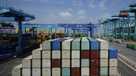 Shipping containers are stacked at a port in Tianjin, China, Friday, Aug. 29, 2025. (AP Photo/Mahesh Kumar A.)