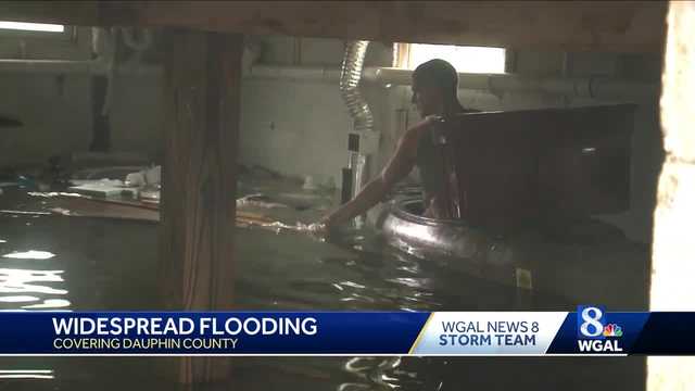 Man Uses Kayak To Retrieve Belongings In Flooded Bat