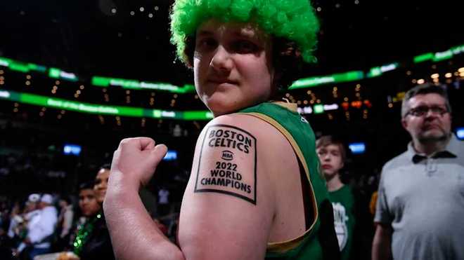 Boston Celtics fan Jack Bienvenue shows off the '2022 world champions' tattoo that he got in March 2022, long before the Celtics reached the 2022 NBA Finals. Unfortunately for Bienvenue, the Celtics lost that championship series to the Golden State Warriors.