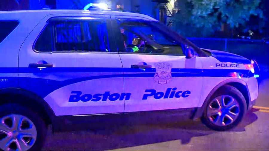 Boston police cruiser at night