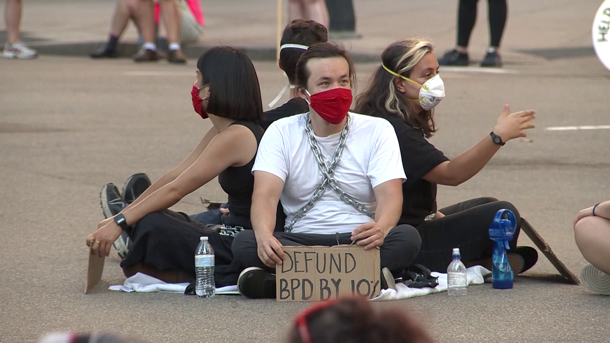 Protesters call for changes to Boston police budget while blocking street