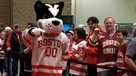Boston University mascot and Boston College fans 2024 Frozen Four