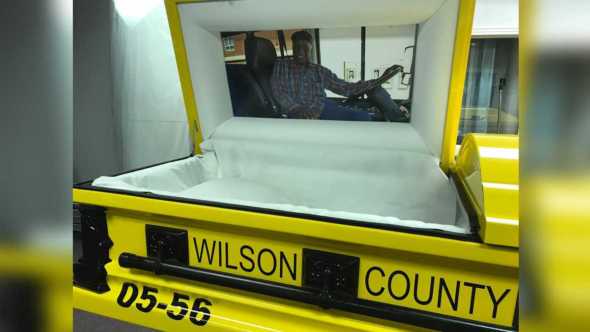 A beloved school bus driver was laid to rest in a custom casket that