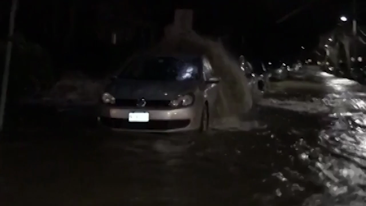 Water main break floods, closes roads