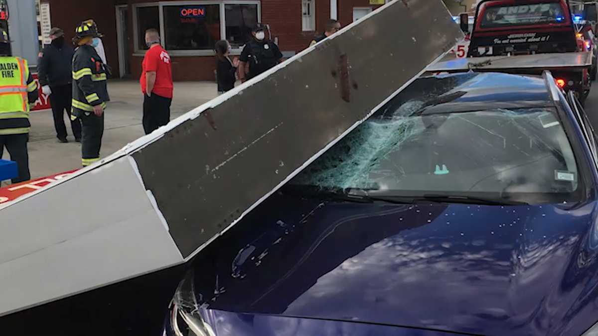 Man concussed after car is hit by falling gas station sign in Malden