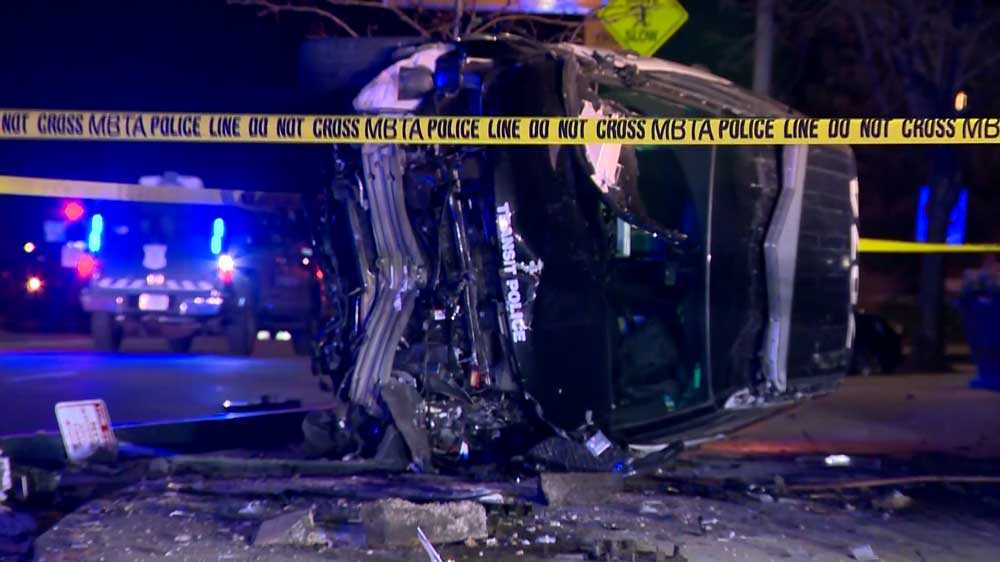 Police cruiser turned on side after crash