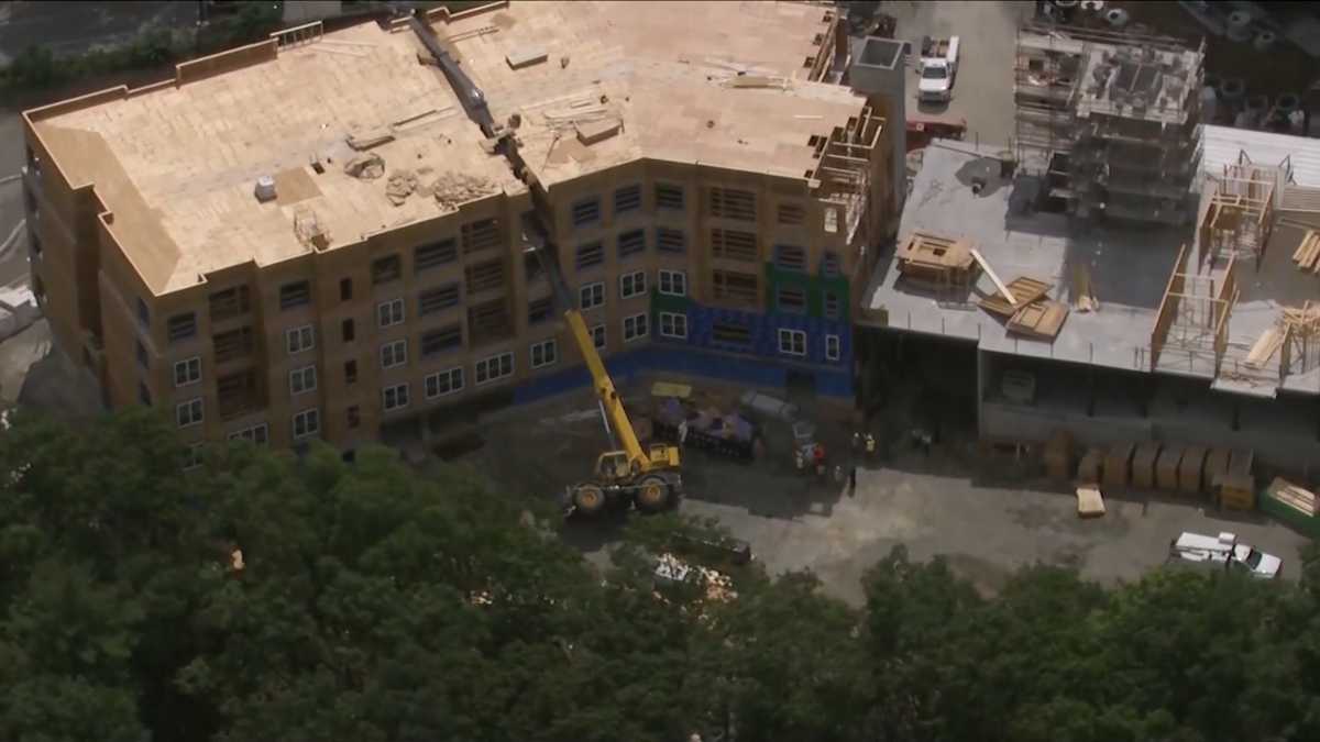 Crane falls onto Winchester apartment building under construction