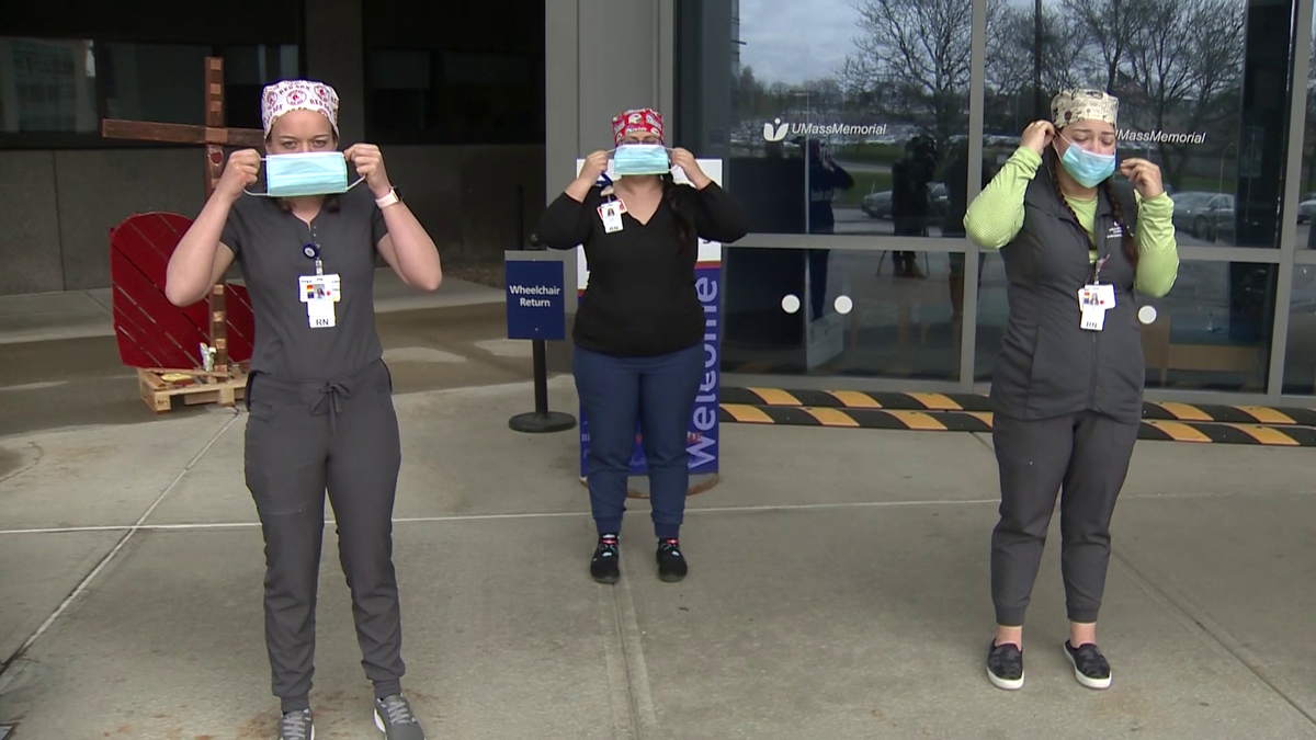 Nurses at UMass Memorial demonstrate proper way to wear face mask
