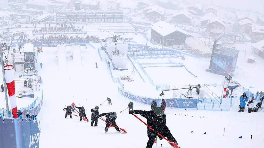 Heavy snow disrupts aerial competitions at Winter Olympics in Italy