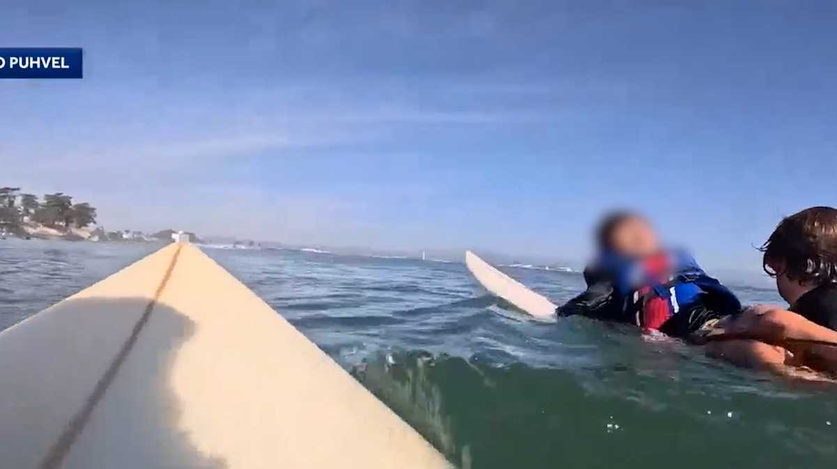 GoPro captures rescue as teen surfer saves child after boat capsizes