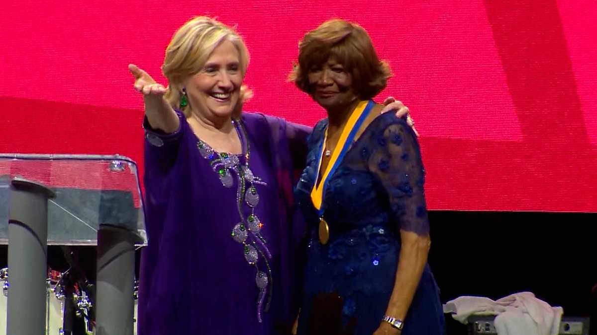 Hillary Clinton attends NAACP convention in Boston, presents award to