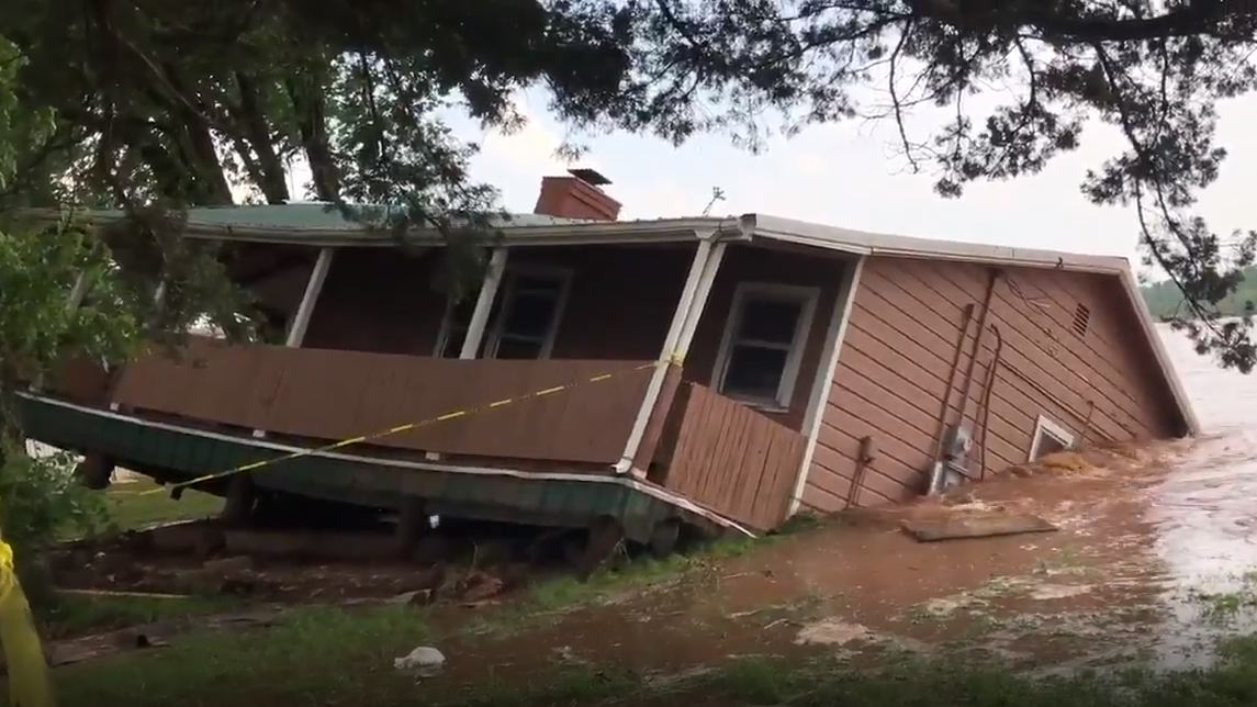 Watch House falls into Cimarron River as floodwaters rise in Crescent