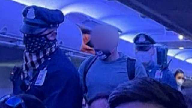 Passenger pulled from plane in Boston for refusing to wear mask - Vimarsana News