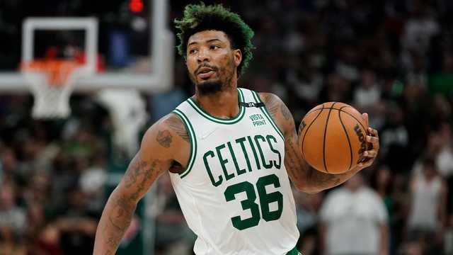 Why does Marcus Smart dye his hair green?
