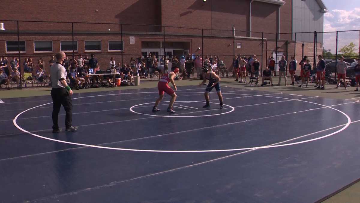 Mass. wrestling team moves mats outside, athletes compete without masks