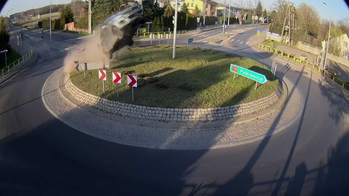 Wild video shows car going airborne after it hits roundabout in Poland