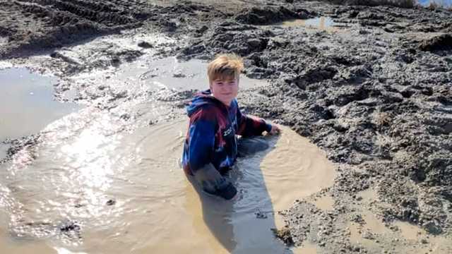 WATCH: A 12-year-old jumped into what he thought was a puddle. He got stuck in a waist-deep sinkhole->