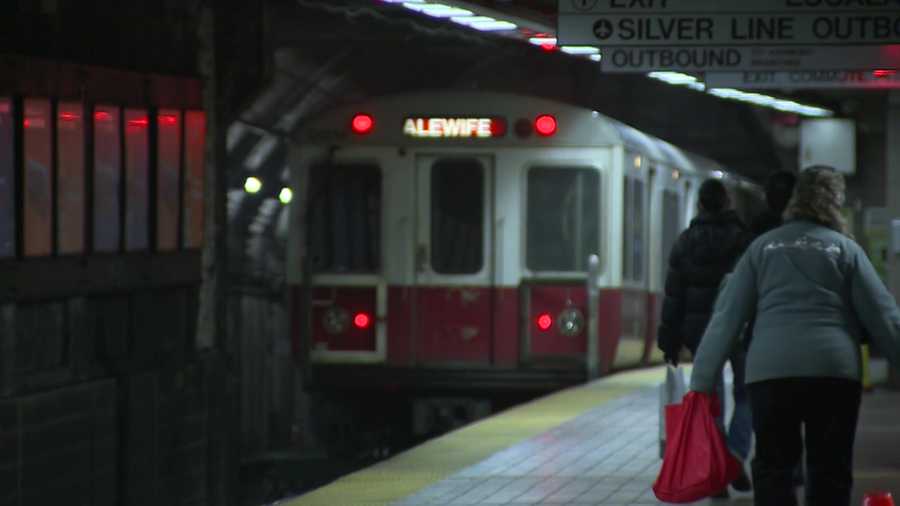 a photo of an alewife-bound mbta train arriving at a station platform