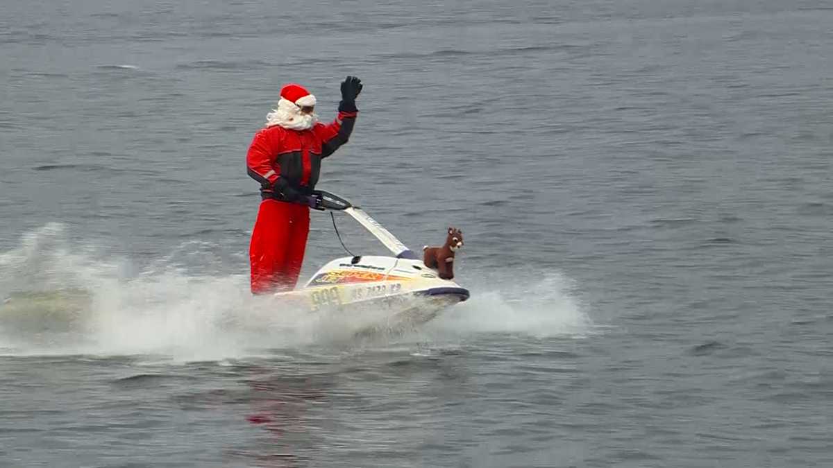 WATCH: Santa Claus cruises Charles River on jet ski