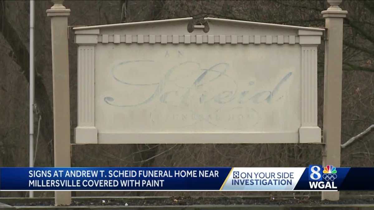 Signs painted over, removed at Andrew T. Scheid Funeral Home near