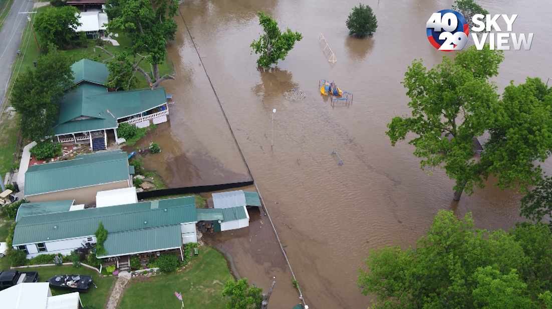 Two large barges head downriver threatening Lock and Dam 16 and bers