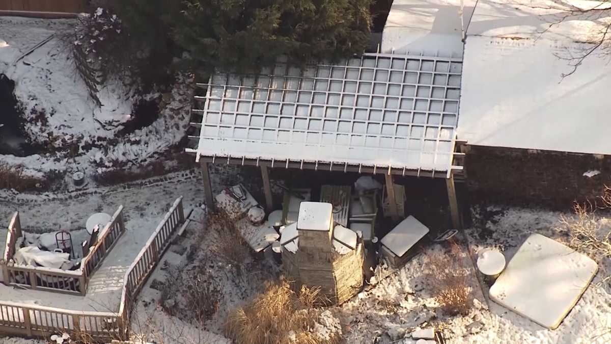 Woman's body found in building behind Massachusetts home