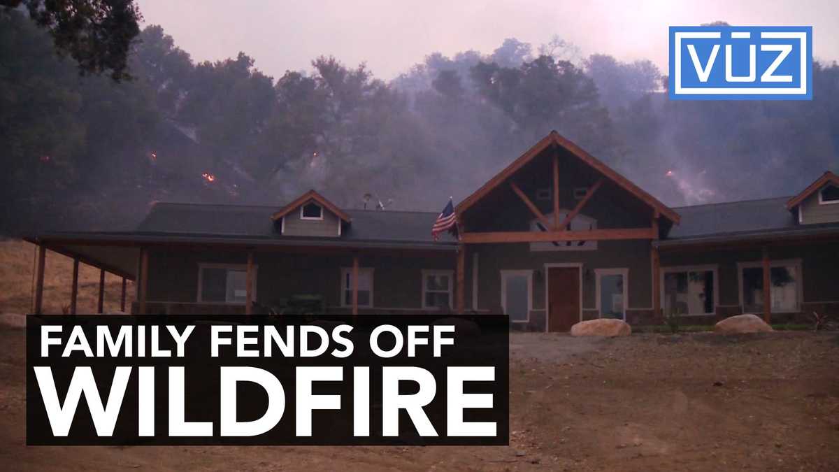 Family holds of wall of fire, saves property