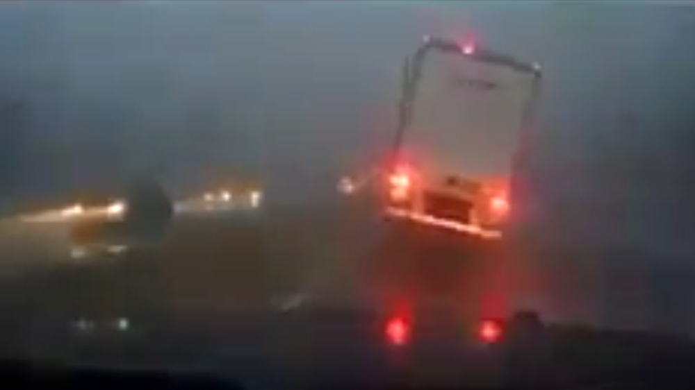 Video shows deadly storm system toppling tractor trailer