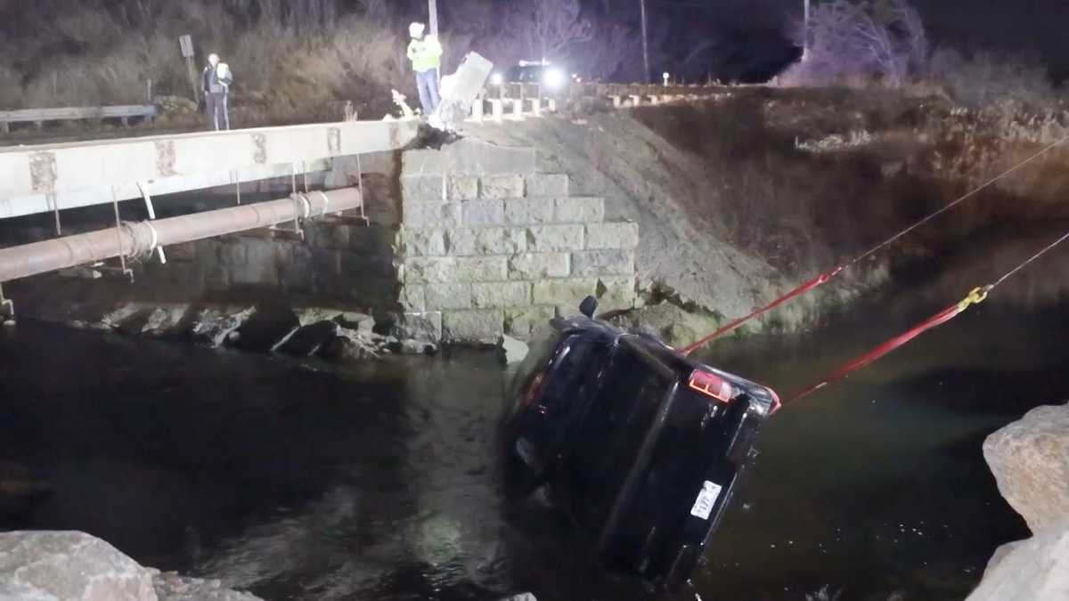 Truck crashes through bridge guardrail, lands in Plymouth river