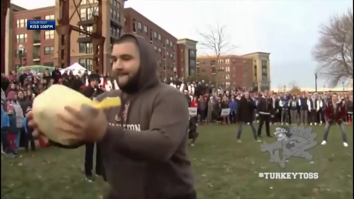 Annual Turkey Toss has birds flying through air