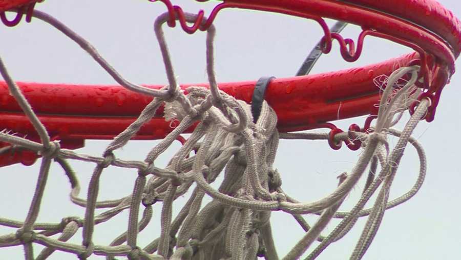 a zip tied basketball hoop at a massachusetts park